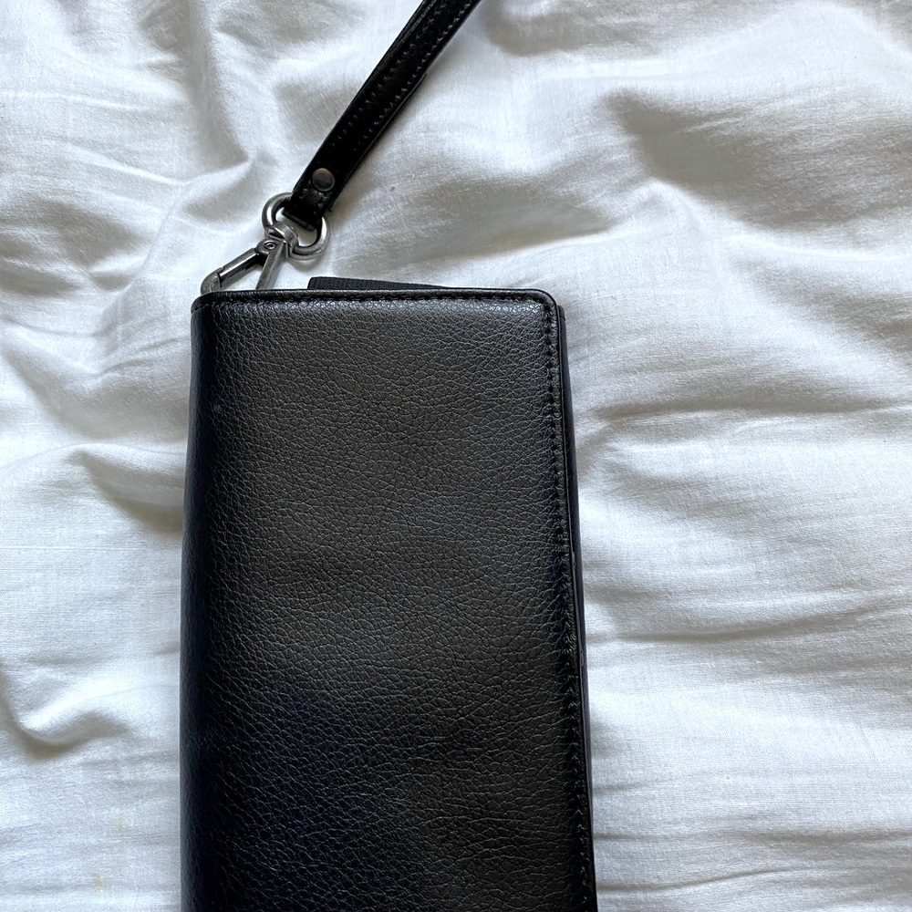 Navy Federal leather phone case / wallet. Open interior card pockets.